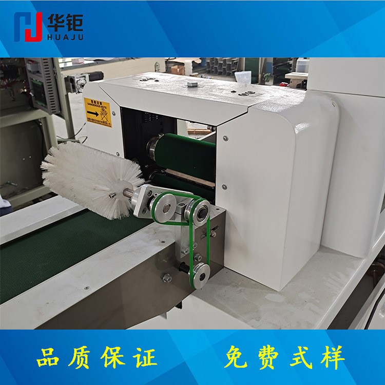 华钜枕式包装机湿毛巾包装机插座包装机 五金包装机下走膜包装机图3