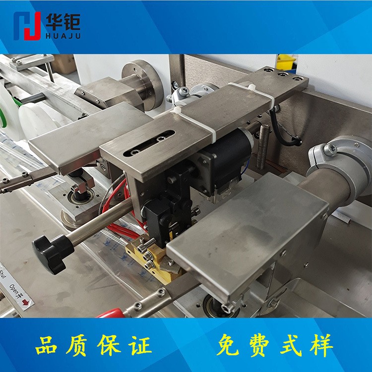 华钜枕式包装机湿毛巾包装机插座包装机 五金包装机下走膜包装机图2