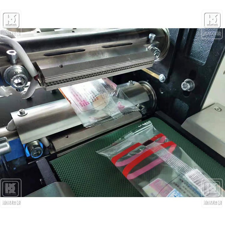 厂家供应食品沙琪玛包装机DK-350自动喷码多功能枕式面包包装机械图5